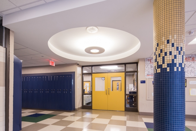 renovated hallway showing new lighting and tiles