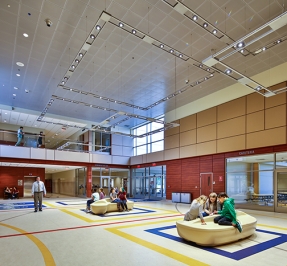 lobby area of the mountview middle school. A few people are in small groups throughout the large space
