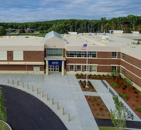 exterior photo taken from above looking down into the entrance of the middle school