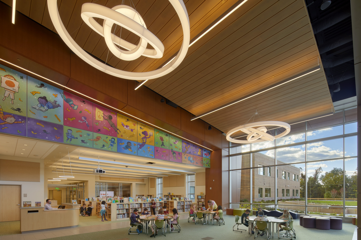 large media center featuring mural by peter reynolds