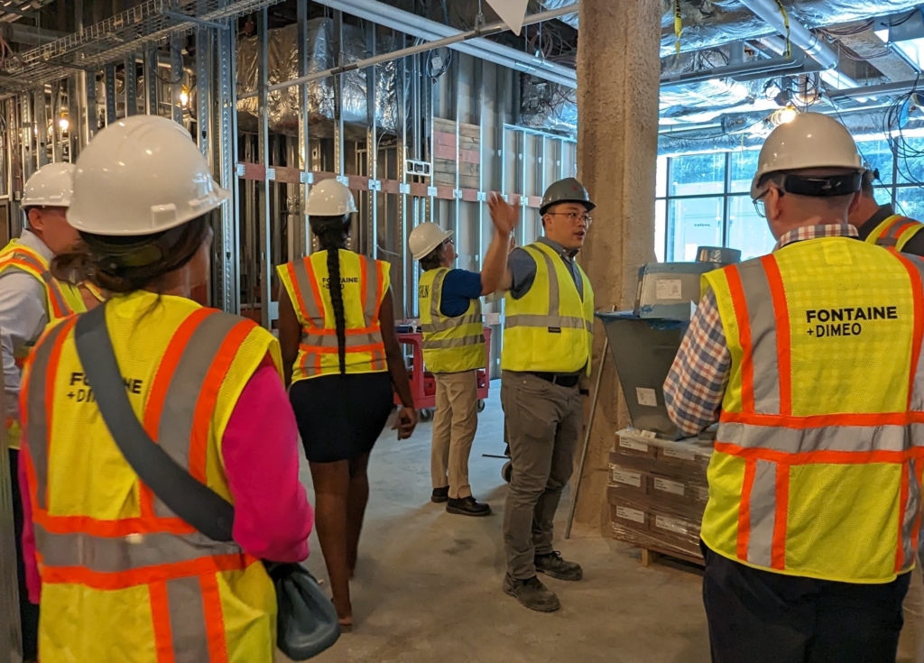 Chris Lee talking at a tour of Doherty High School under construction