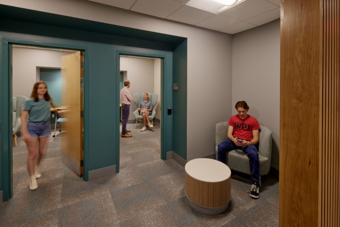 two offices and a waiting area show people moving through the spaces