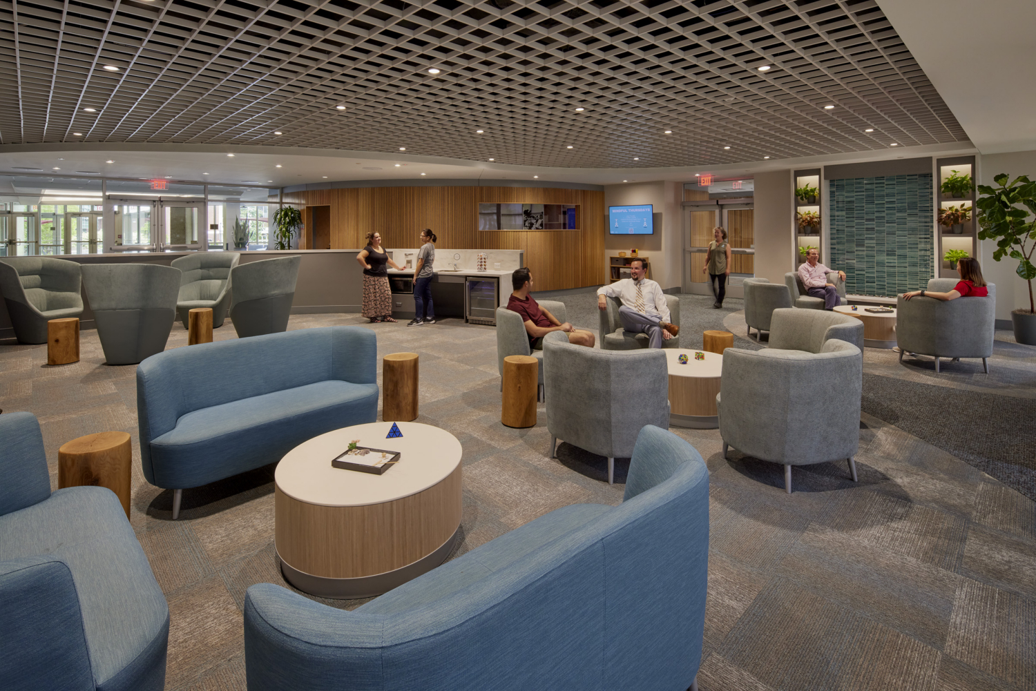 open area in the center for well being with couches arranged in small circles